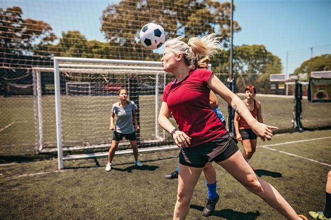 Ball hitting soccer player on head