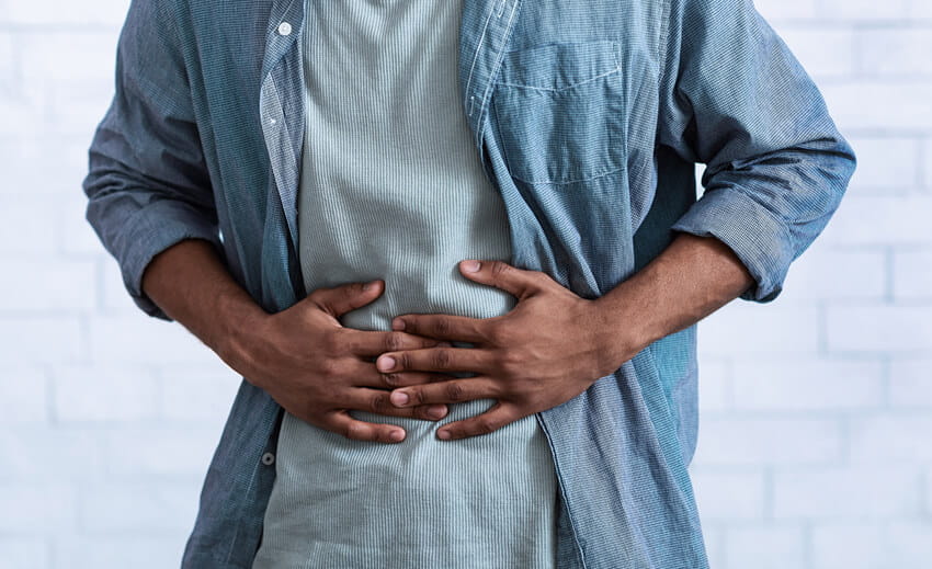 man holding stomach