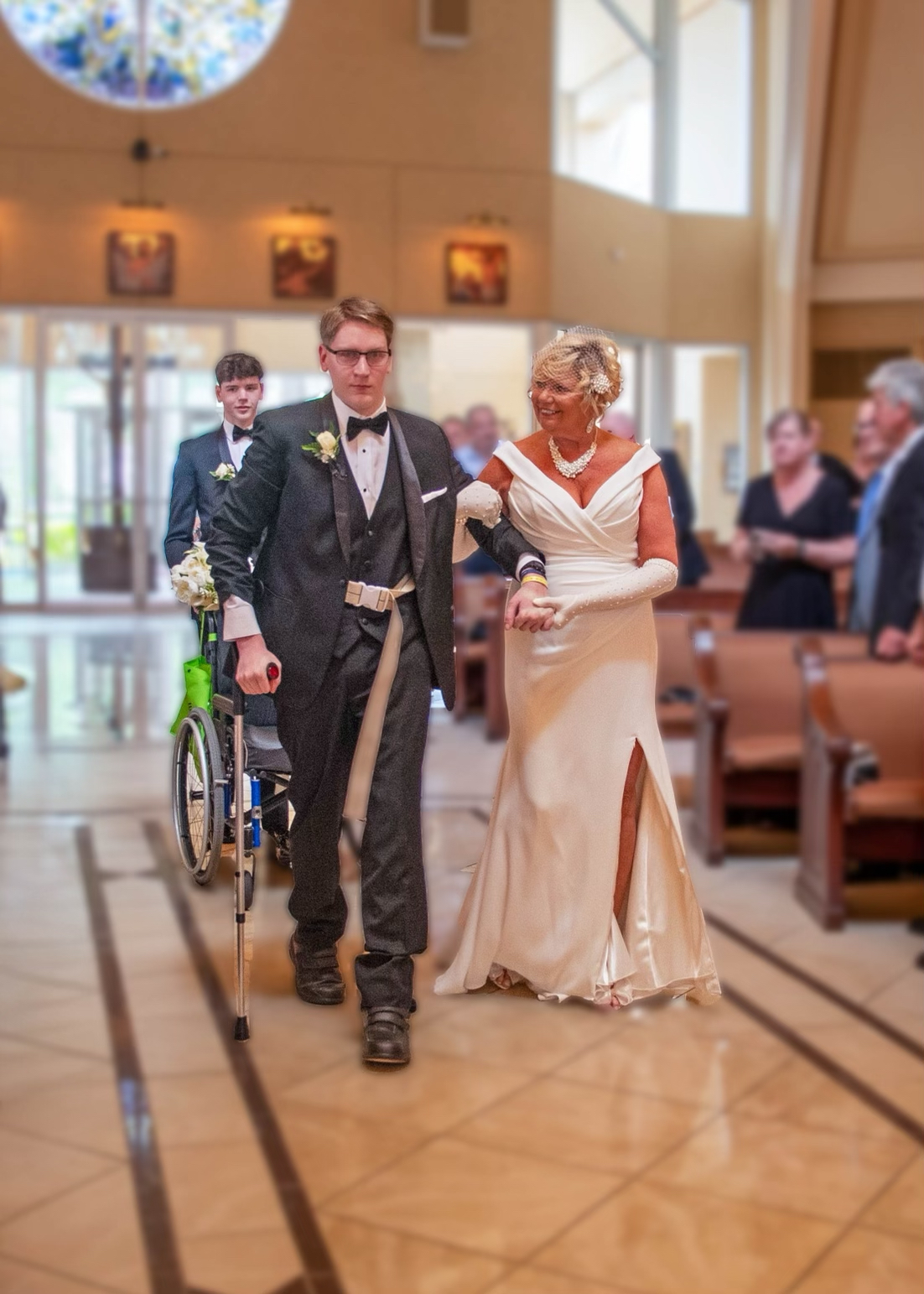Cole Keith walking his mother down the aisle at her wedding.