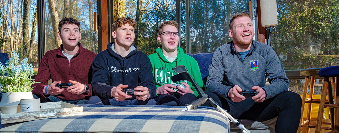 Cole Keith and his friends playing a video game.