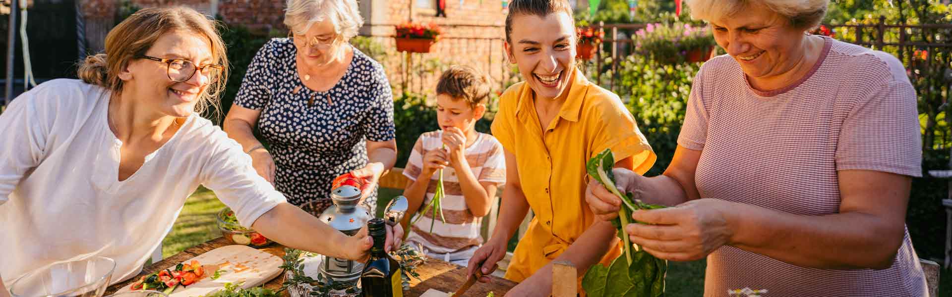 people laughing enjoying dinner outside