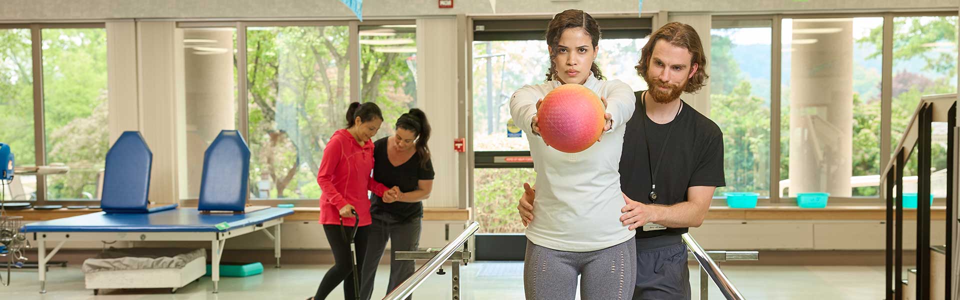 girl at phsyical therapy with a trainer