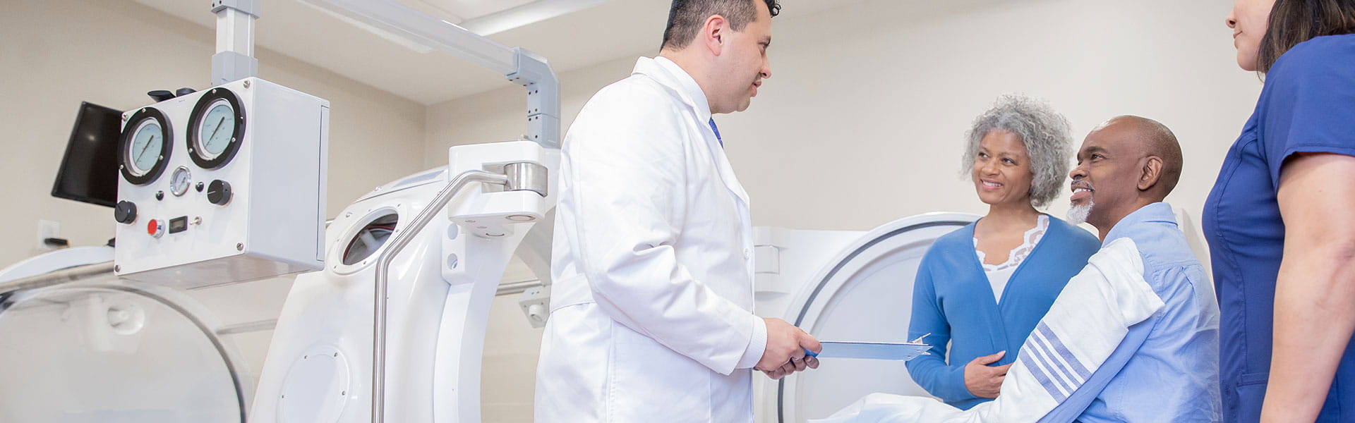 doctor talking to patient and spouse