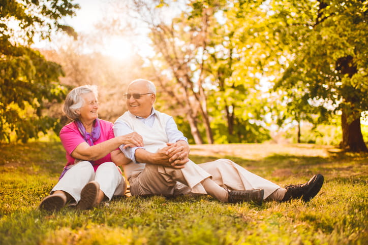 Happy older couple relaxing in nature